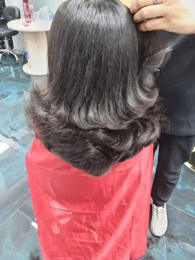 Layered blow-dry hair styling result at Eternal Beauty ladies salon in Deira