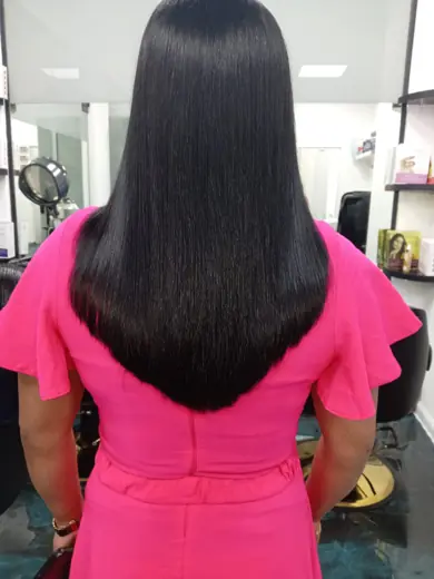 Silky straight long black hair after smoothing treatment at Eternal Beauty