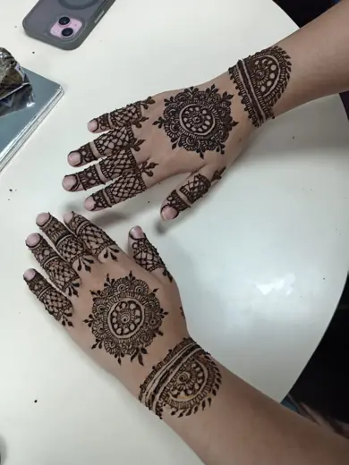 Mandala henna design on both hands by Eternal Beauty henna artist
