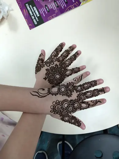 Traditional henna artwork covering both palms at Eternal Beauty Dubai